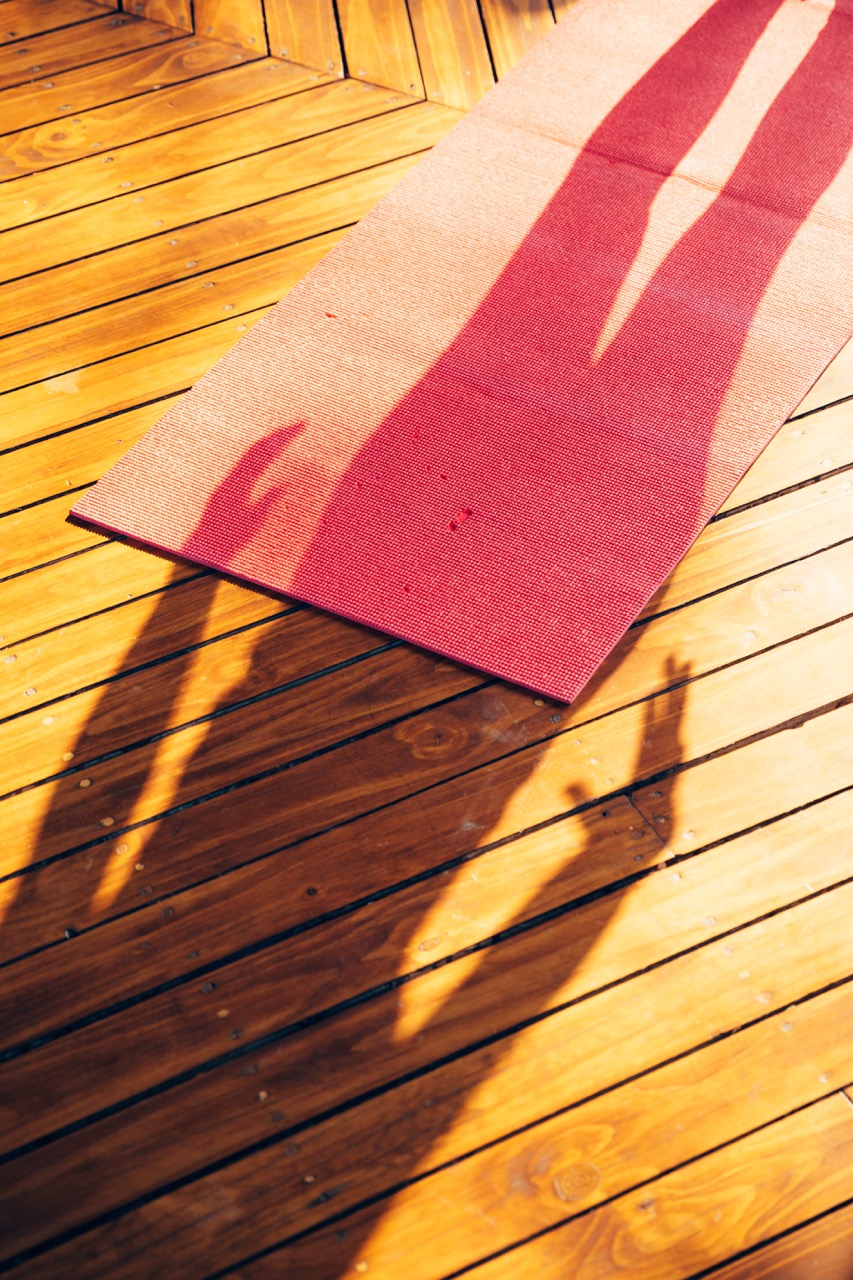 Picture of a shadow on a yoga mat